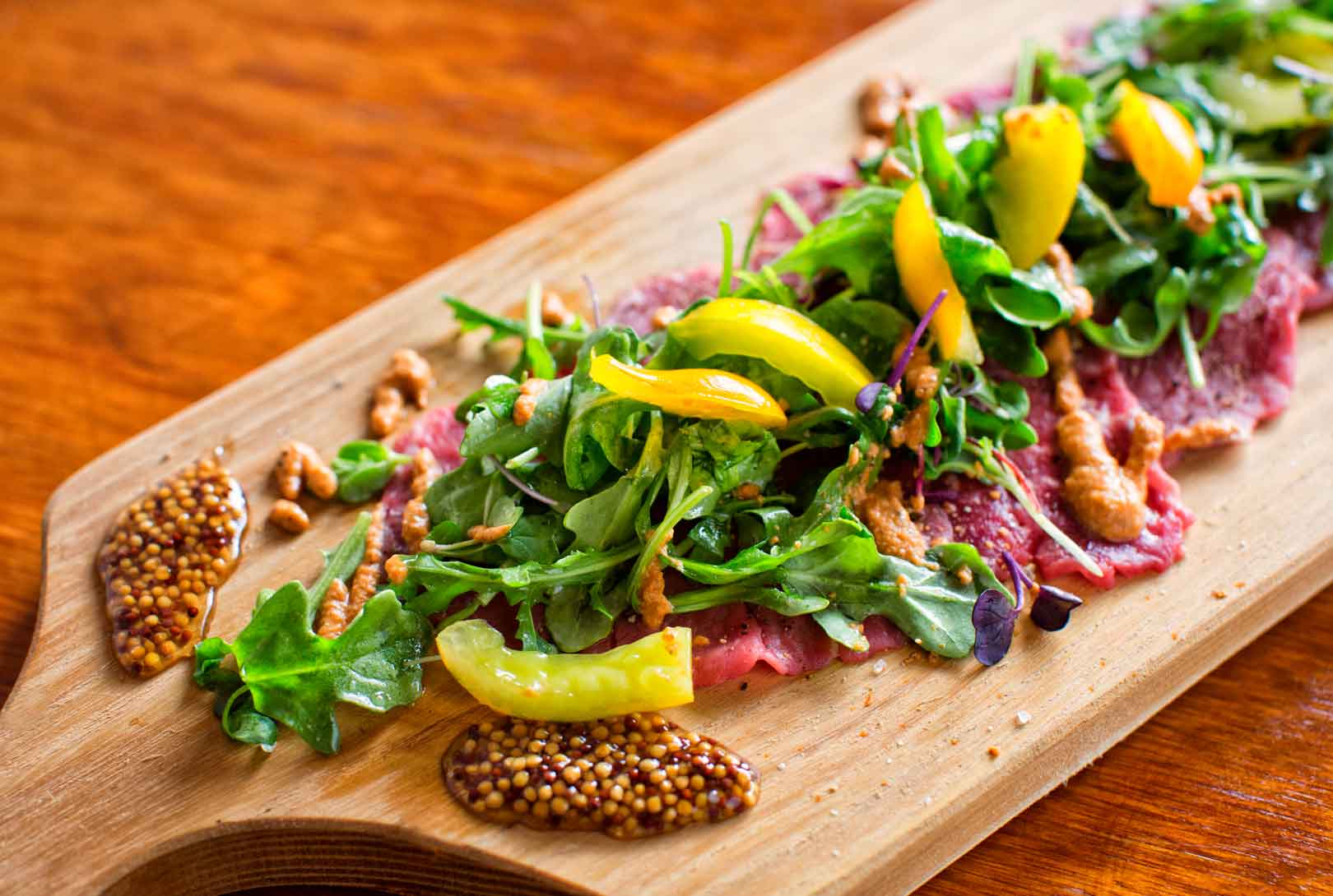 Beef Carpaccio Topped With Arugula, Peppers And Jam