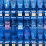 Blue pharmaceutical drug bins filled with pills for automated pharmacy dispense prescriptions
