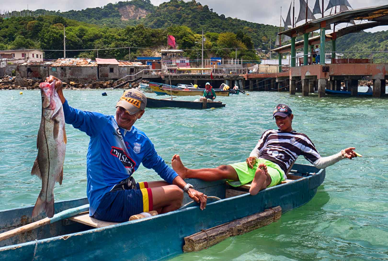 Two Fishermen In A Boat In Bahia de Caraquez Ecuador
