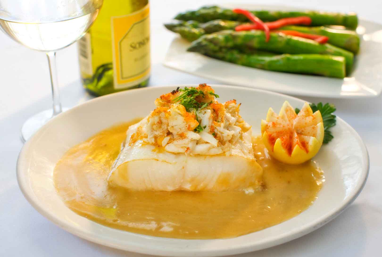 Fish With Crab Stuffing And Asparagus Served With White Wine