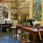 potting shed room and garden work area with barn wood decor, an old metal sink, large windows, and a work area