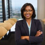 PR headshot of attorney Raquel Bellamy in downtown high-rise conference room
