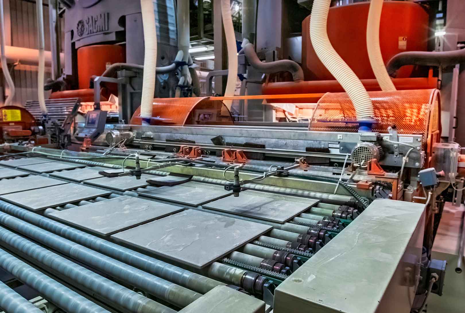 orange tile manufactiuring machine in a factory