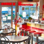 Elliston Place Soda Shop restaurant dining room with red barstools, chairs and soda bar in Nashville