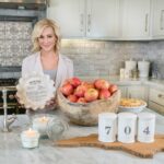 Kellie Pickler in kitchen showcasing candles, salt-n-pepper shakers, cutting boards and pie plates