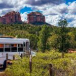 white surfer bus in parking lot near Red Rock Crossing near Cathedral Rock in Sedona Arizona