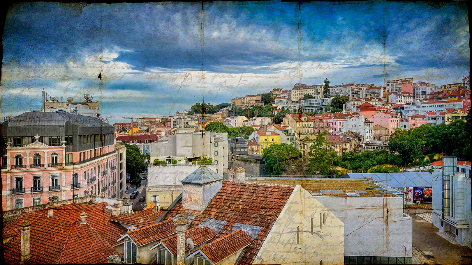 Cityscape view of Lisbon, Portugal, with colorful buildings, red rooftops, and a cloudy sky, seen from an elevated perspective. From Postcards From Europe Fine Art Series.