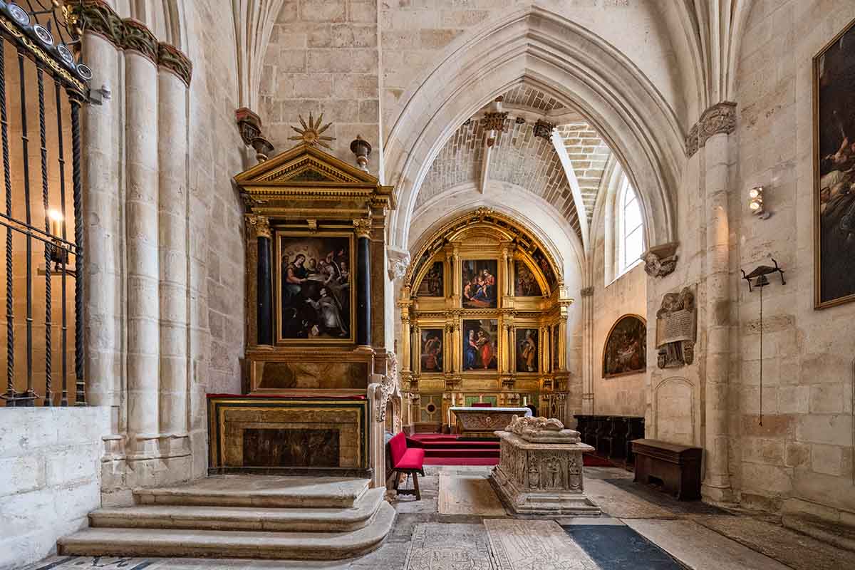 A stone wall and a stone altar in the Burgos Cathedral in Spain.