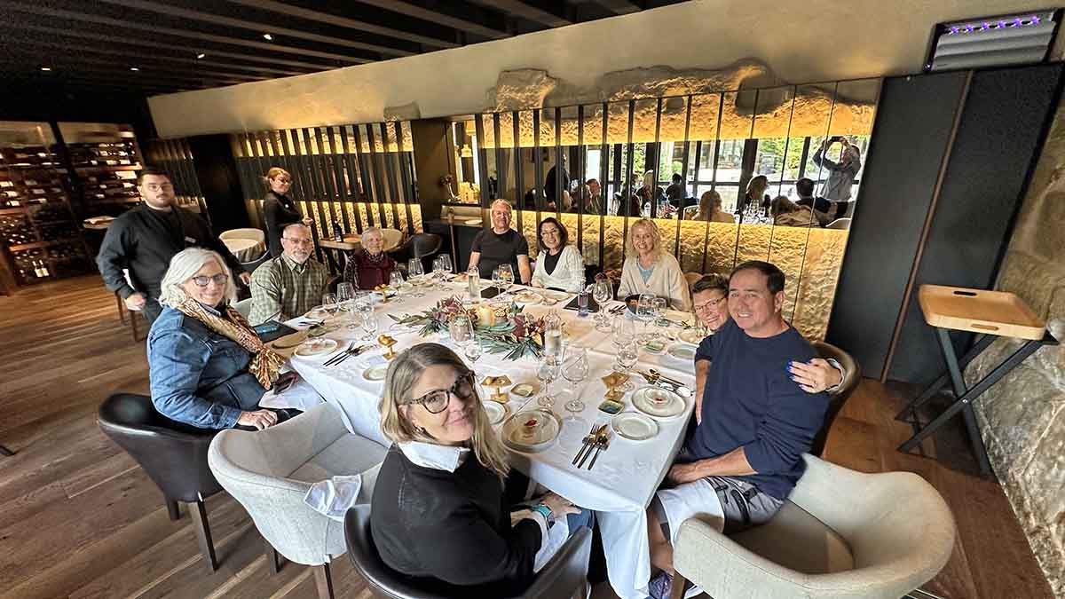 A group of travelers having a 5-star Michelin lunch with the Luxe Adventure Tours in Briones, Spain, at the Allegar Restaurant.