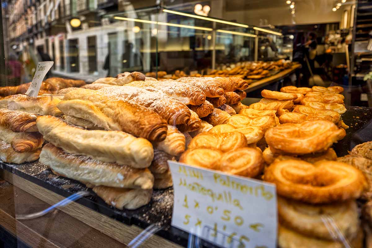 A window display of Spanish pastries and treats in Segovia, Spain.