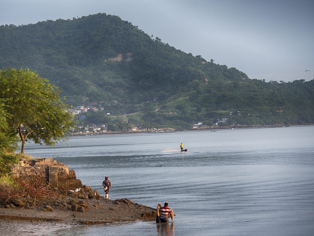 Fisherman working from their boats in the bay area of Bahia de Caraquez, Ecuador