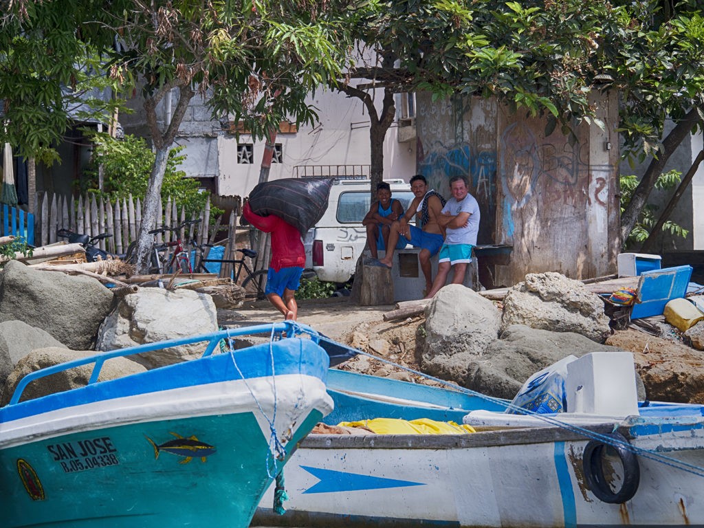 People along the shore of Bahia de Caraquez, Ecuador.