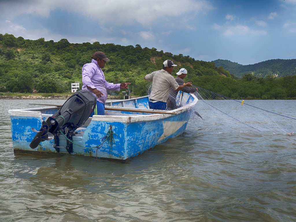 Fisherman working from their boats in the bay area of Bahia de Caraquez, Ecuador.