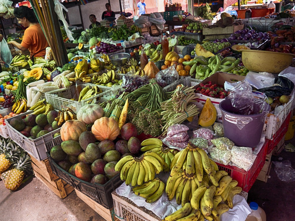 Fruit and vegitable stand at the semi open air market in downtown Bahia de Caraquez, Ecuador