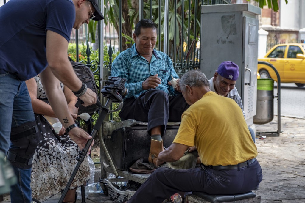 Videographer Mathew Wijatyk films local shoe shine vendors in the streets of Guayaquil, Ecuador.