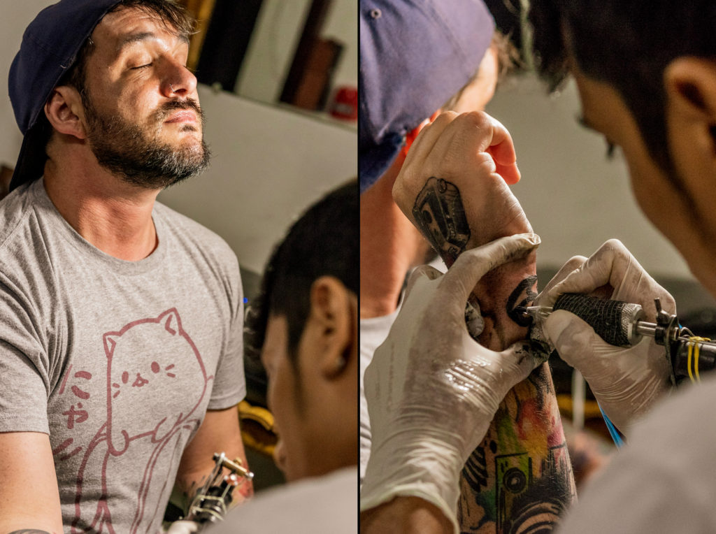 Student Eric Dulberg from Nossi College of Art gets a tattoo while in the surf town of Montañita, Ecuador.