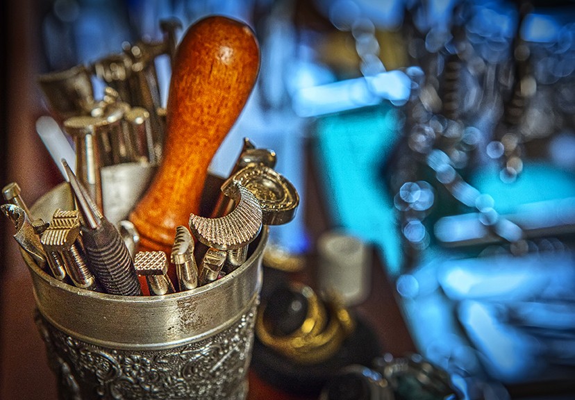 Leather making tools in a metal cup